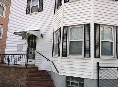Aluminum awning, with trim, for a rental property in New Bedford, MA.