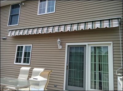 With the awning mounted to the wall studs, it's time to roll it out for some shade!