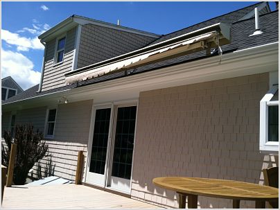 Roof Mounted Retractable Awning with a motorized crank in Mattapoisett, MA
